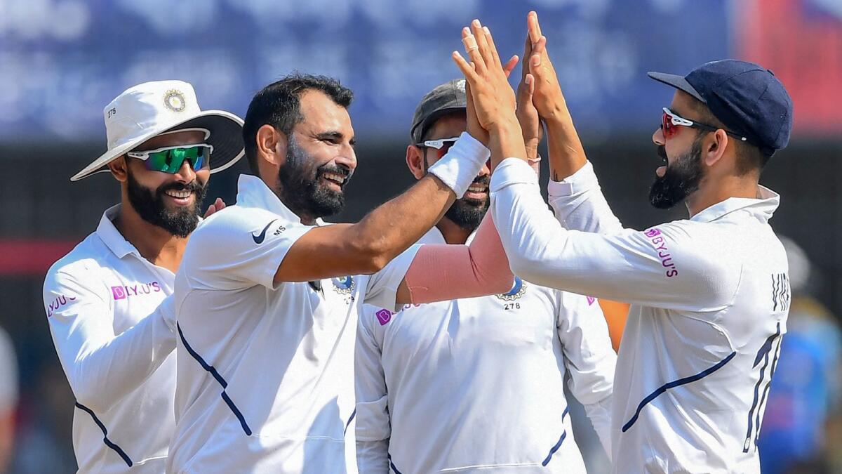 India's Mohammed Shami (second left) celebrates a wicket with teammates. (AFP file)