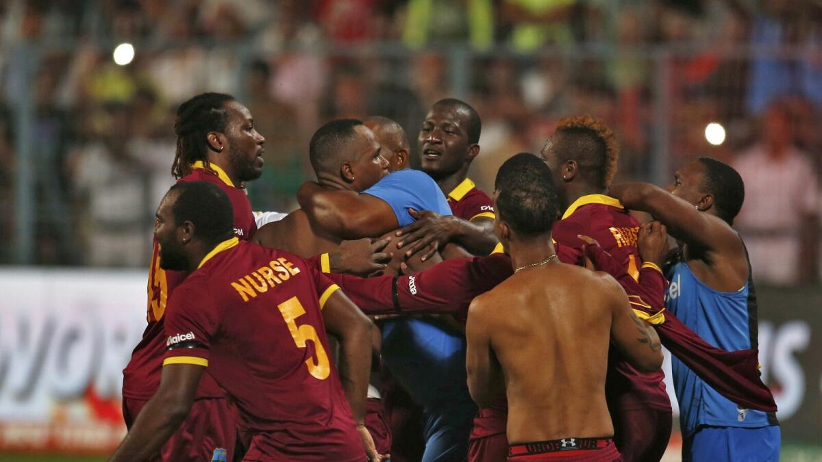 West Indies players celebrate after winning the final.