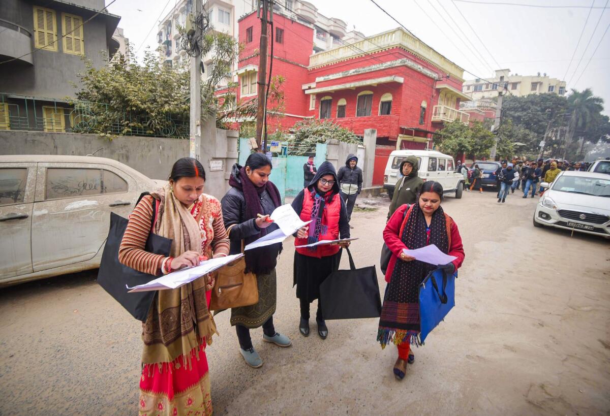 Enumerator staff  prepare to record data during the first phase of much-hyped caste-based census in Bihar state in Patna on January 7, 2023. Photo: PTI