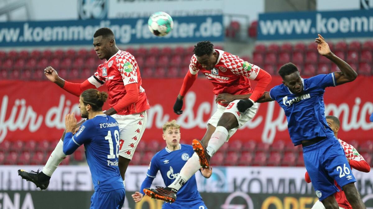 Mainz 05's Jean Philippe Mateta and Moussa Niakhate in action with Schalke 04's Goncalo Paciencia and Salif Sane. — Reuters