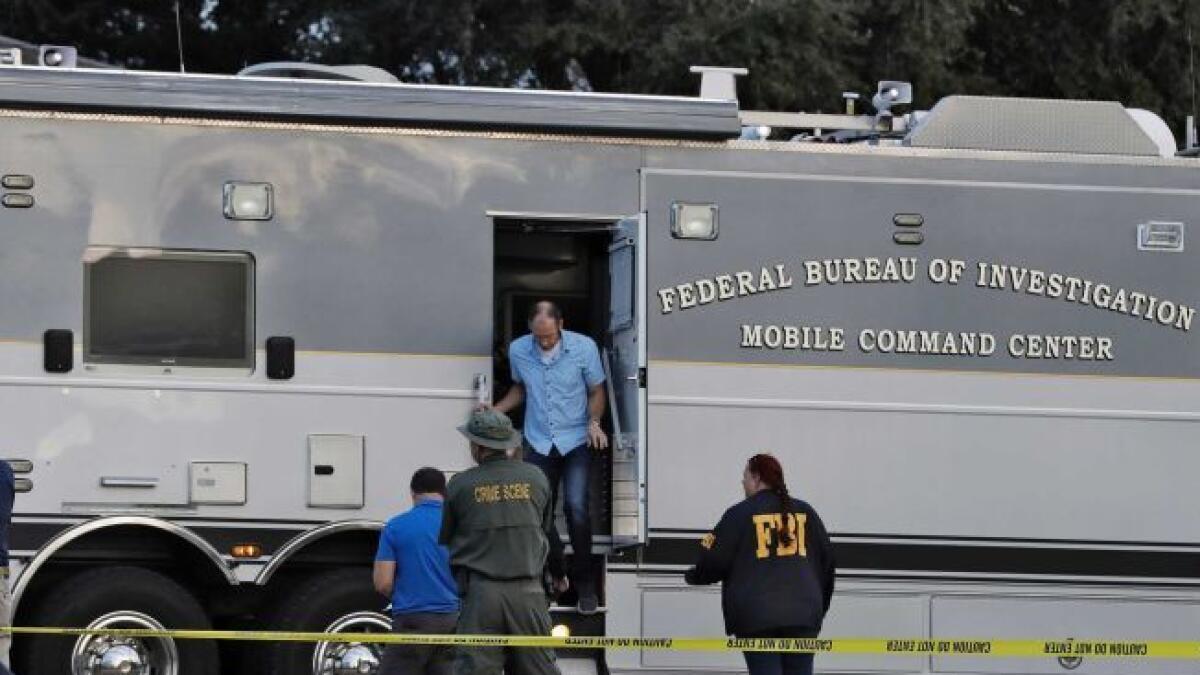 Five killed in Florida bank shooting, suspect surrenders 