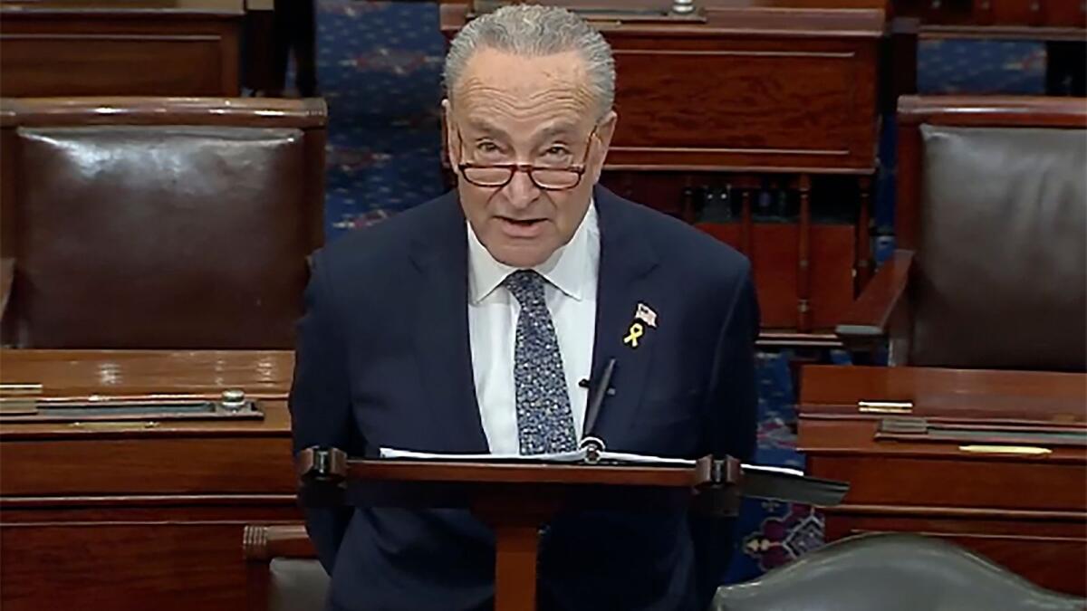 Senate Majority Leader Chuck Schumer speaks on the Senate floor at the Capitol in Washington on Thursday.  — AP