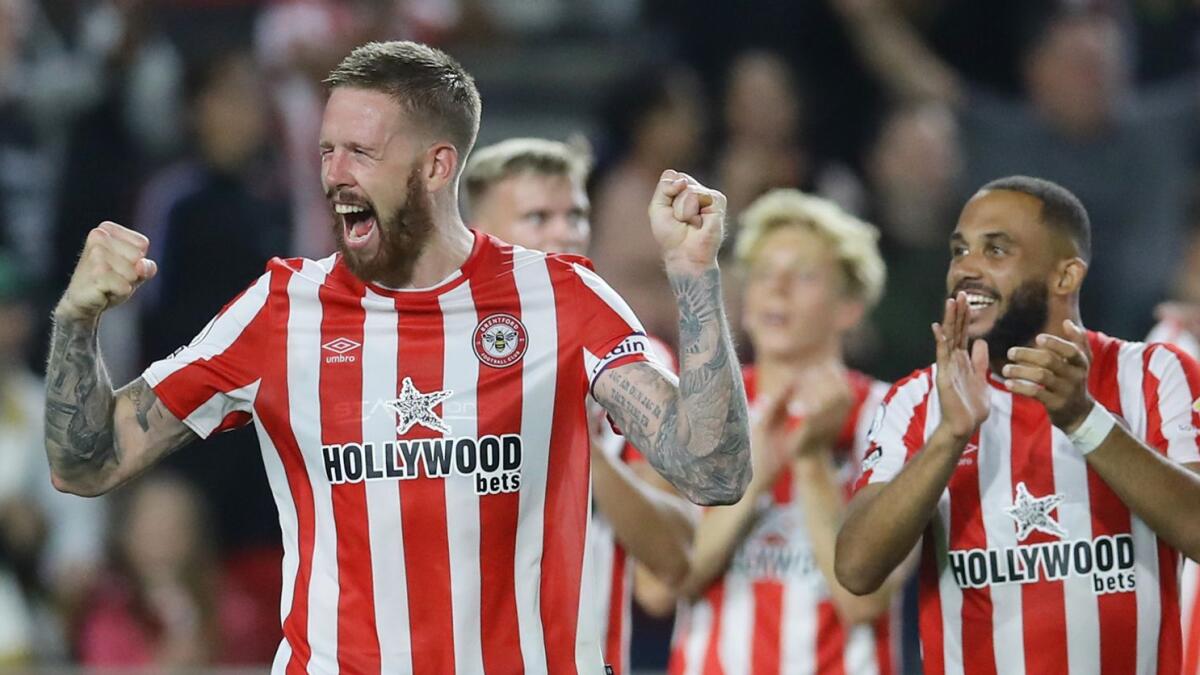 Brentford's Pontus Jansson celebrates with teammates after beating Arsenal in Premier League match. — Reuters