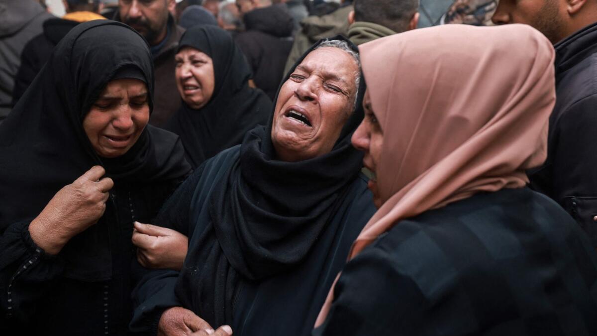 People mourn relatives killed in overnight Israeli bombardment, outside the Al Najjar hospital in Rafah. Photo: AFP