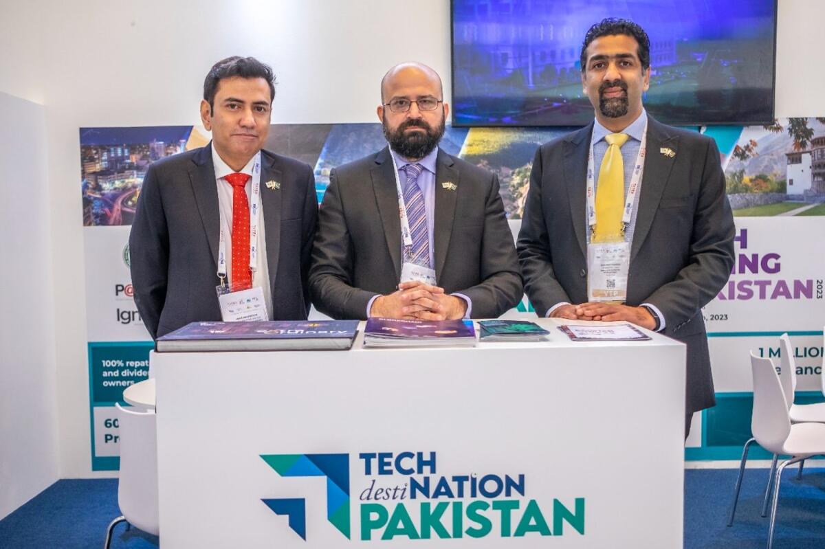 Amar Makhdoom, Chief Marketing officer of Pakistan Software export board, Zeeshan Rehman Khattak, Chief Commercial Officer of IT Ministry PSEB and Shahbaz Hameed, Director of Business Development IT Ministry PSEB at Pakistan pavilion at GITEX 2022 show, Dubai's annual enterprise technology and global digital transformation event. 11 October 2022. Photo by Shihab