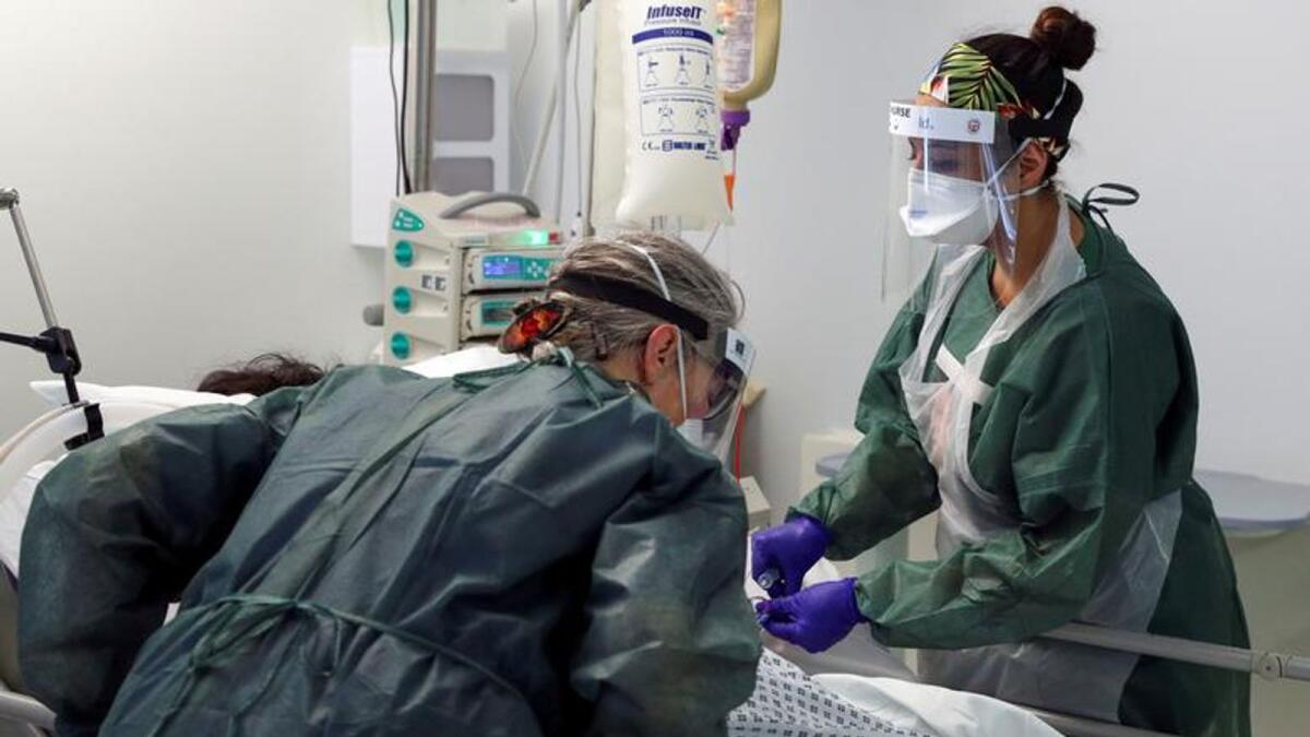 Nurses care for a patient in an Intensive Care ward treating victims of the coronavirus disease (COVID-19) in Frimley Park Hospital in Surrey, Britain, May 22, 2020.