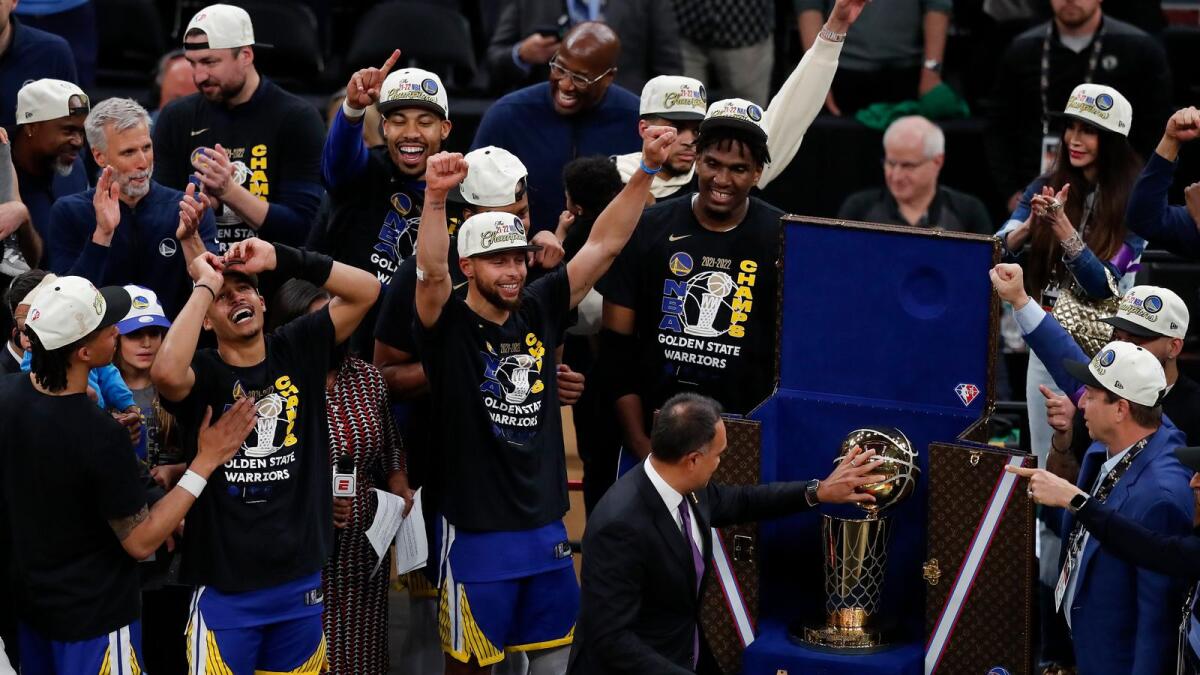 The Golden State Warriors celebrate after defeating the Boston Celtics in Game 6 to win the NBA Finals on Thursday. — AP