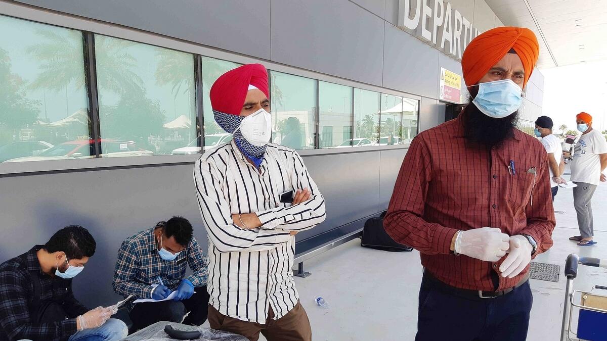 Daljeet Singh, who works as a supervisor in a crane rental company, awaits to board the special flight from Dubai.