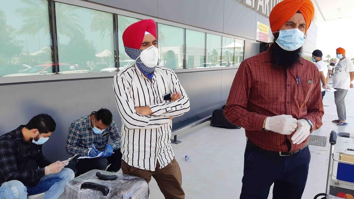 Daljeet Singh, who works as a supervisor in a crane rental company, awaits to board the special flight from Dubai.
