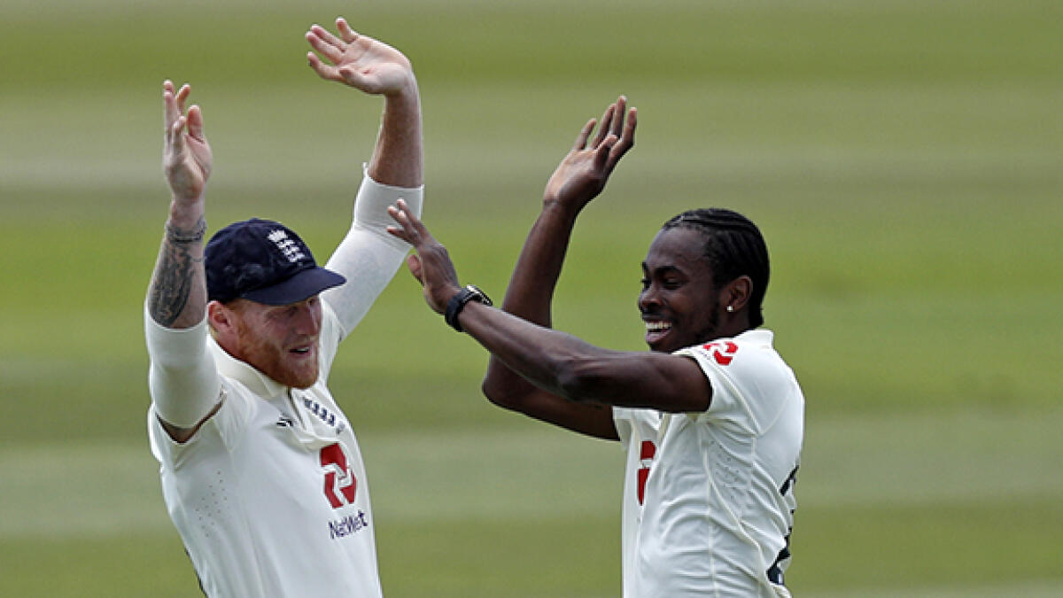 Ben Stokes said the team would be there to support fast bowler Jofra Archer (right), who was dropped for breaching bio-secure protocols. -- AFP