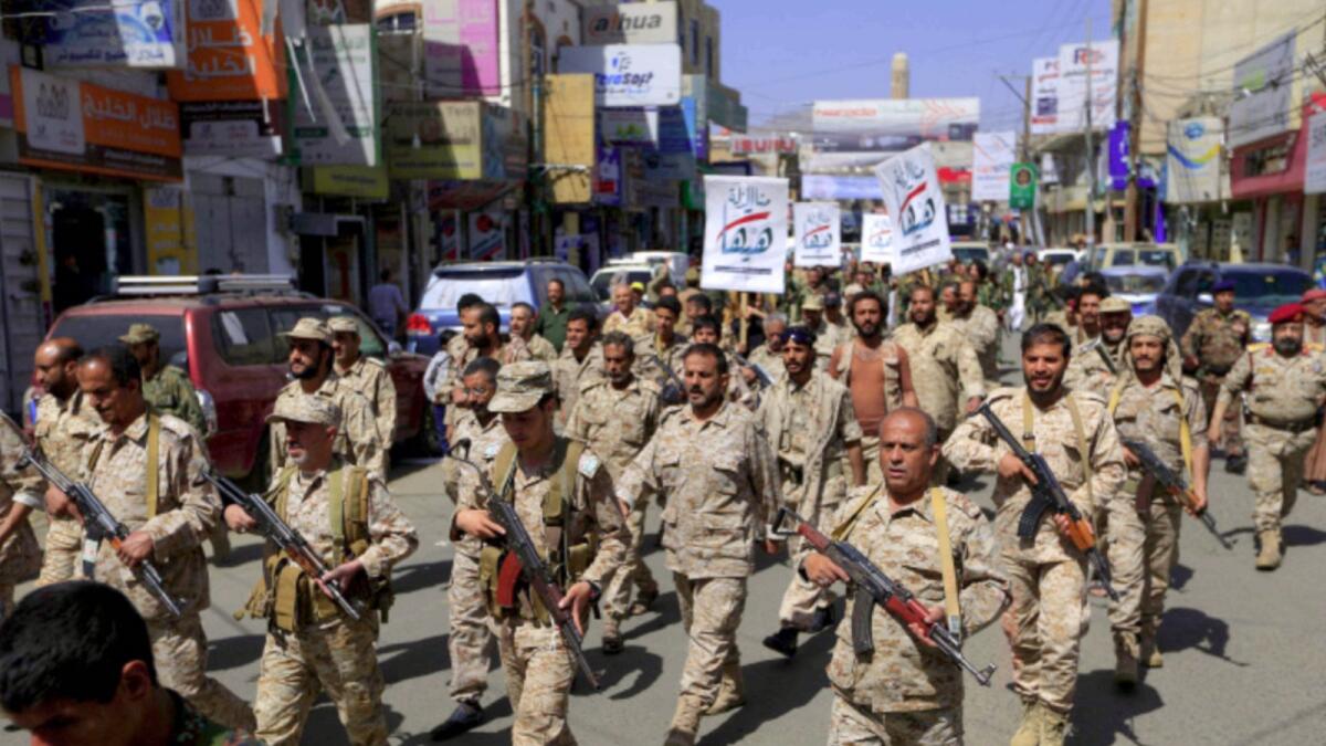 Forces loyal to Yemen's Houthi militia take part in a military parade in Sanaa. — AFP