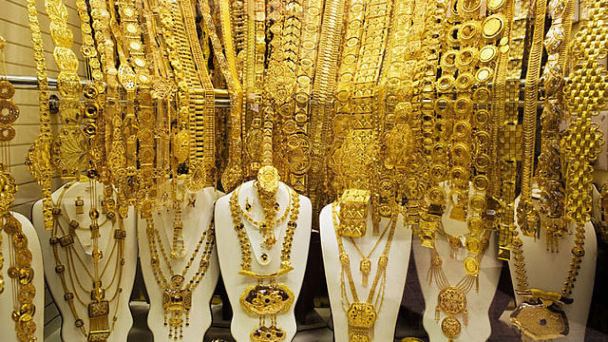 Gold prices slip after a one-month high