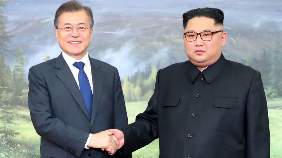 Leaders of Koreas hold surprise meeting as Trump revives hopes of summit