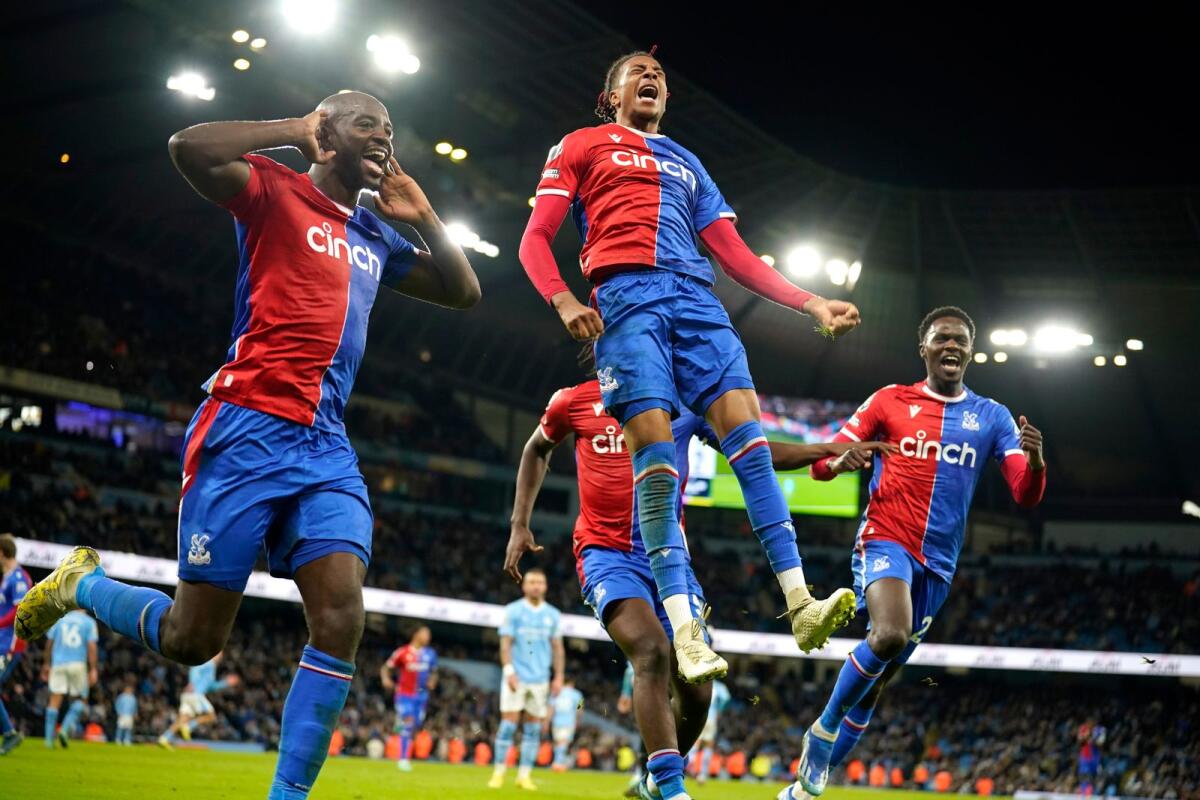 Crystal Palace players celebrate after Crystal Palace's Michael Olise (Centre) scored his side's second goal during the English Premier League against Manchester City. - AP