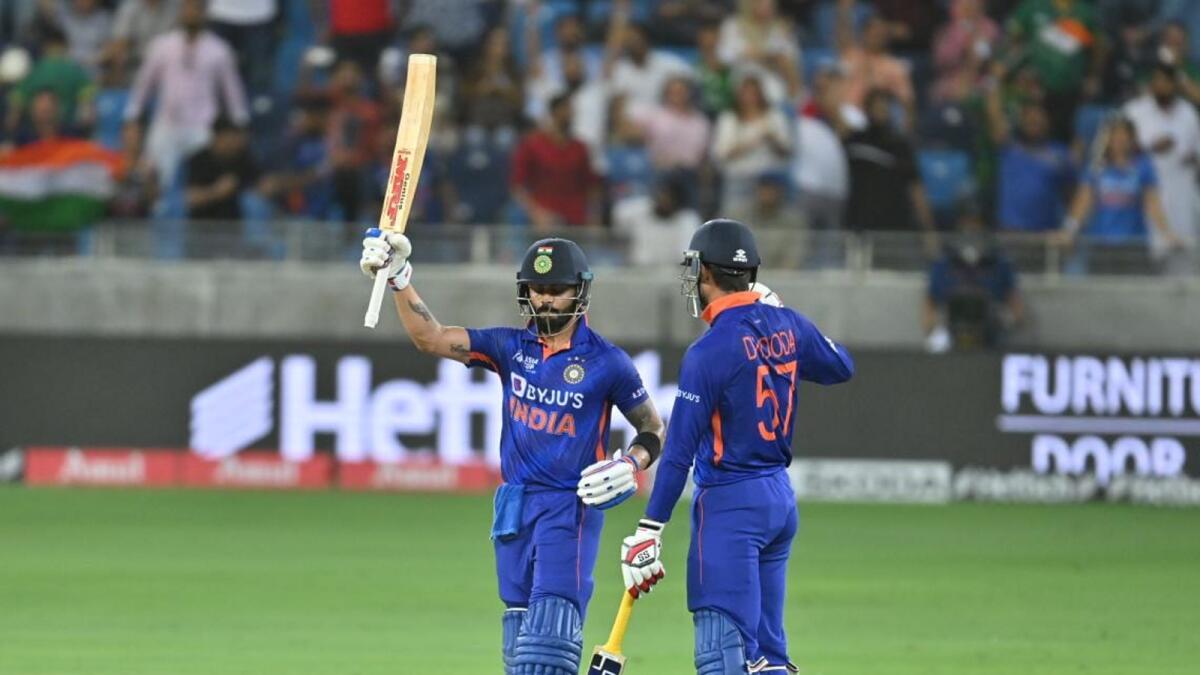 India's Virat Kohli celebrates after scoring a half-century against Pakistan in Dubai on Sunday. — M Sajjad