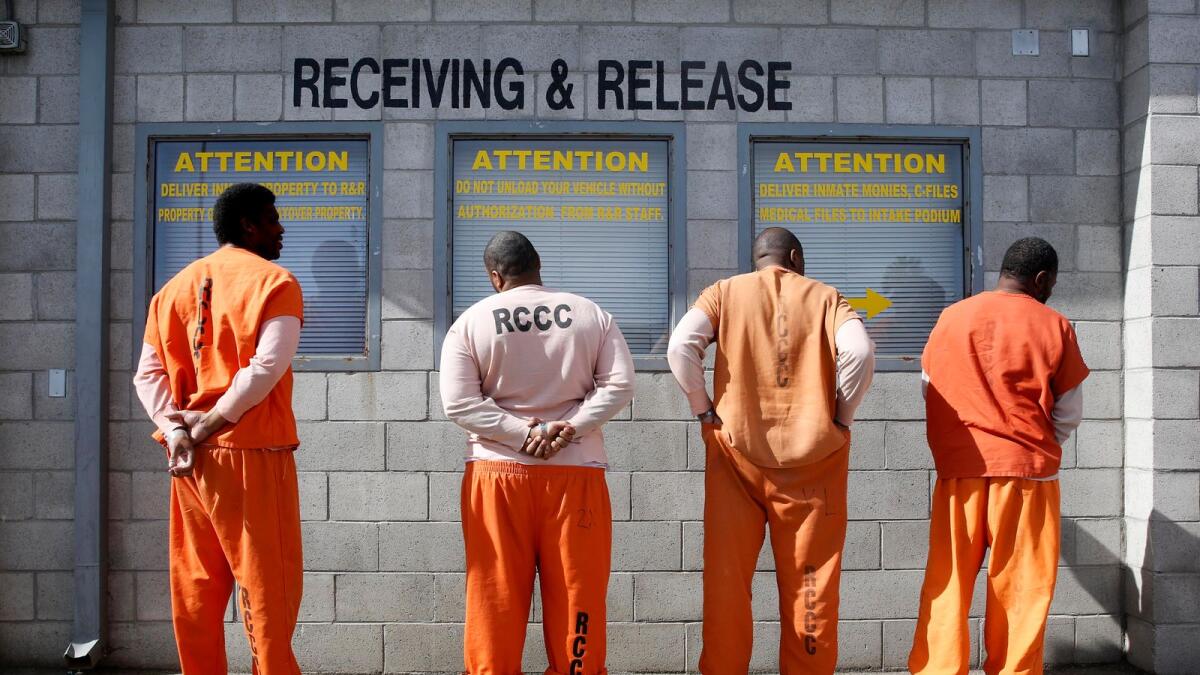 In this Feb. 20, 2014 file photo, prisoners from Sacramento County await processing after arriving at the Deuel Vocational Institution in Tracy, California. In 1971, President Richard Nixon declared a war on drugs.