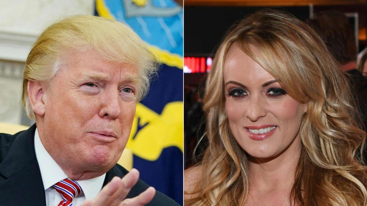 This combination of file pictures shows US President Donald Trump responding to a reporter's question in the Oval Office of the White House in Washington, DC, and adult film actress/director Stormy Daniels attending the 2018 Adult Video News Awards at the Hard Rock Hotel &amp; Casino in Las Vegas, Nevada.
