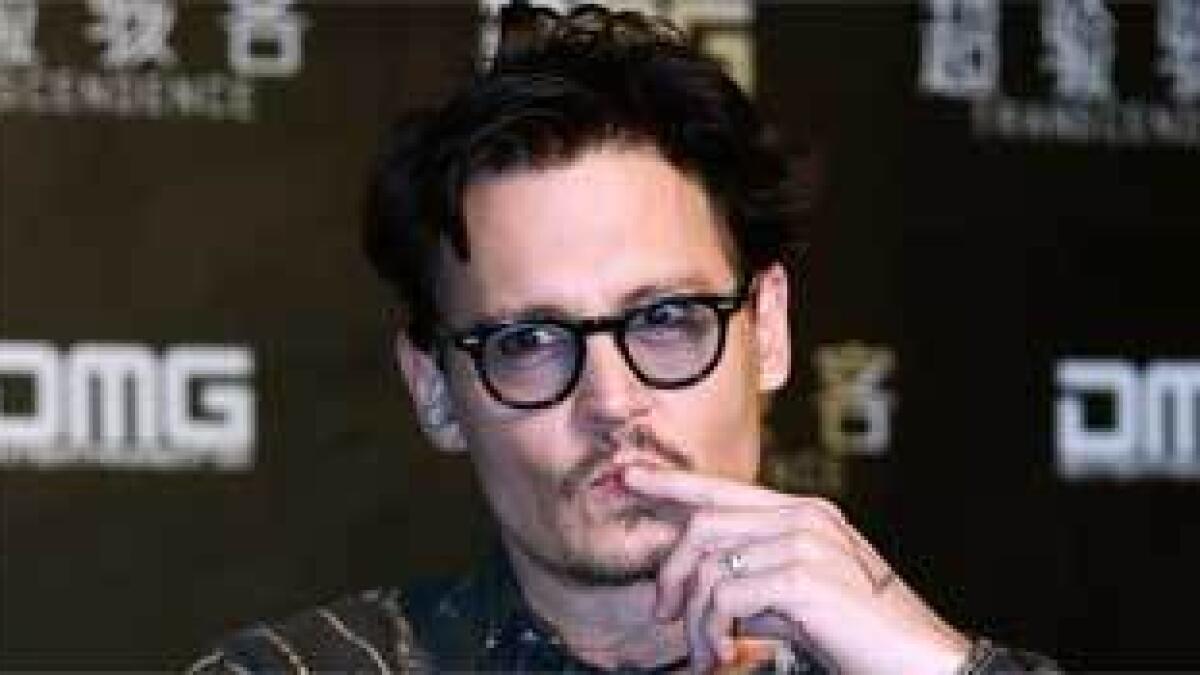Johnny Depp shows off ‘chick’s ring’