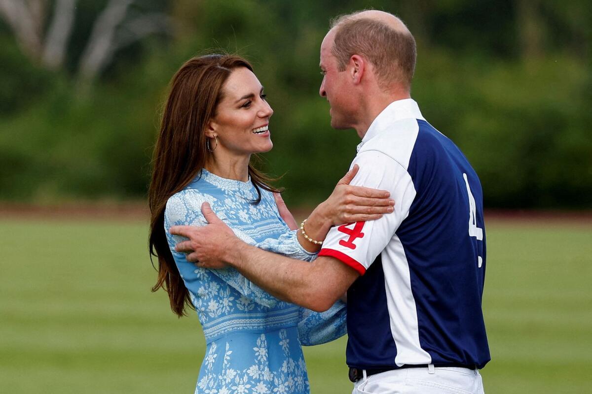 Prince William and Catherine, Princess of Wales, hold each other at the Royal Charity Polo Cup event in Windsor on July 6, 2023.— Reuters