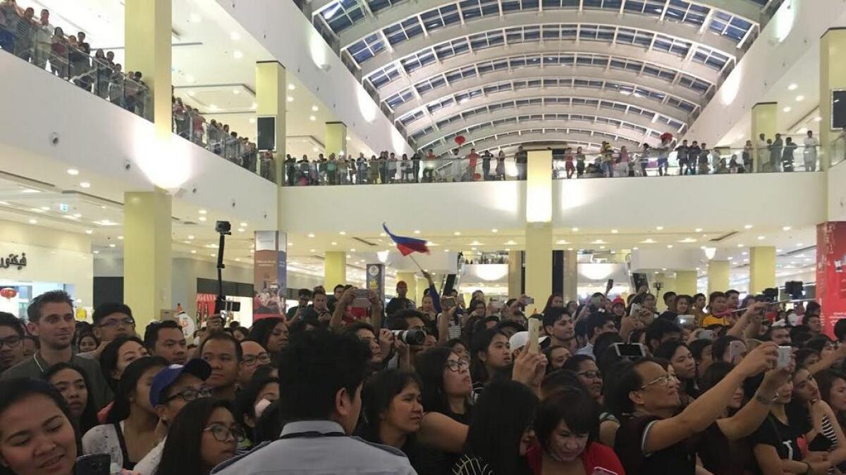 The Filipino flag being unfurled as audiences see Pia Wurtzbach here at Dragon Mart 2 in Dubai.