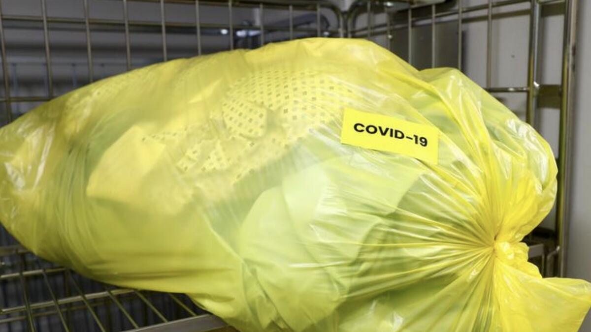 A sticker reading 'Covid-19' is pictured on a bag with medical clothes amid the coronavirus outbreak in Brussels, Belgium.