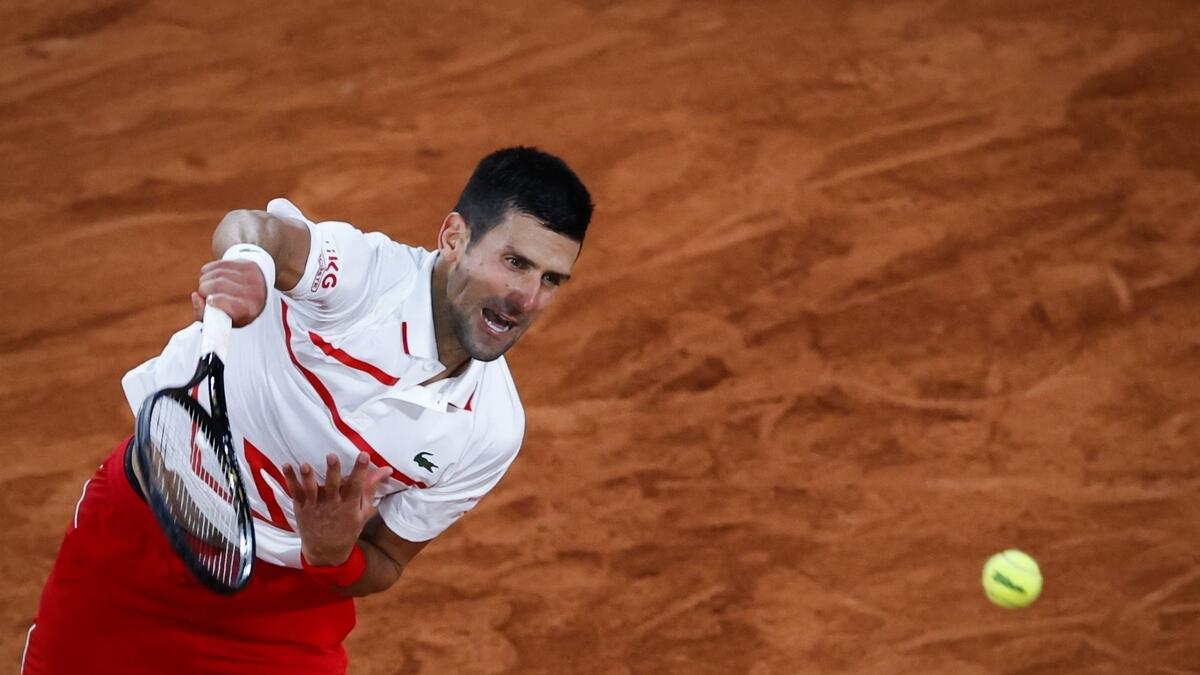 Serbia's Novak Djokovic serves during his match against Sweden's Mikael Ymer at the French Open. (AFP)