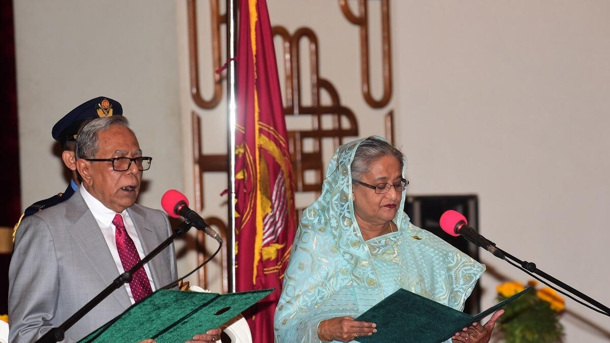 Bangladesh President Abdul Hamid (L) swears in Sheikh Hasina (R) for her fourth spell as Bangladeshs prime minister at the Presidential Palace in Dhaka.-AFP