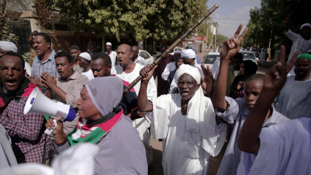 People protest in Khartoum against a military coup. — AP