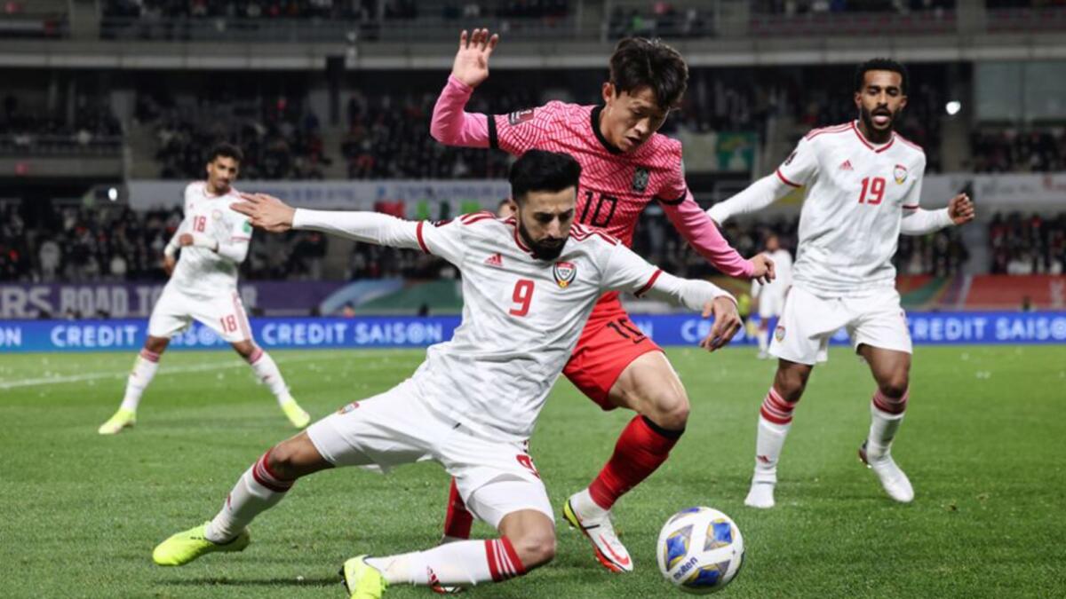 The UAE's Bandar Al Ahbabi (front) tussles for possession with South Korea's Jae-Sung Lee on Thursday. — AFC website