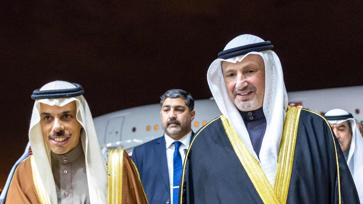 Kuwait's Foreign Minister Sheikh Salem Abdullah Al Jaber Al Sabah (right) welcoming his Saudi counterpart Faisal bin Farhan Al Saud at Kuwait international airport in Kuwait City on February 4, 2023. — AFP File