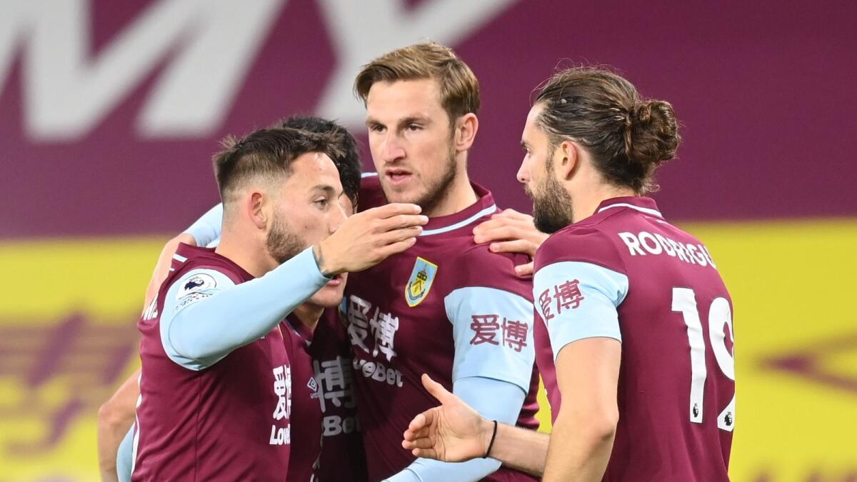Burnley's Chris Wood (second right) celebrates scoring their first goal with teammates during the Premier League match against Crystal Palace. — Reuters