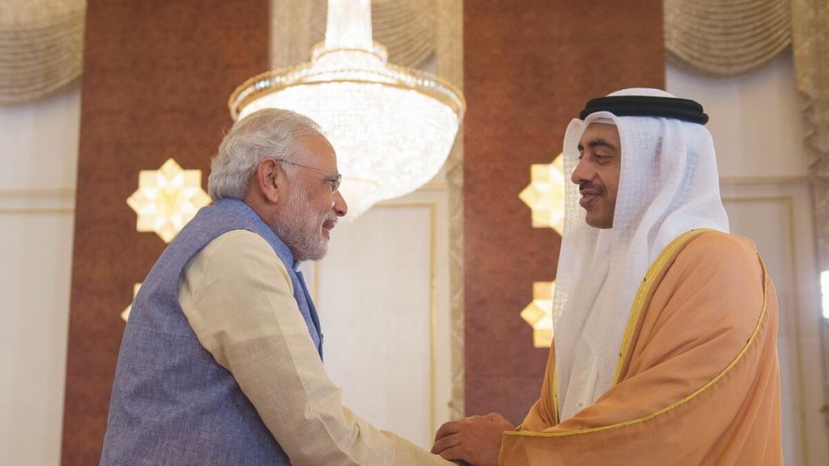 Shaikh Abdullah bin Zayed Al Nahyan, UAE Foreign Minister (R), greets Narendra Modi, Prime Minister of India (L).