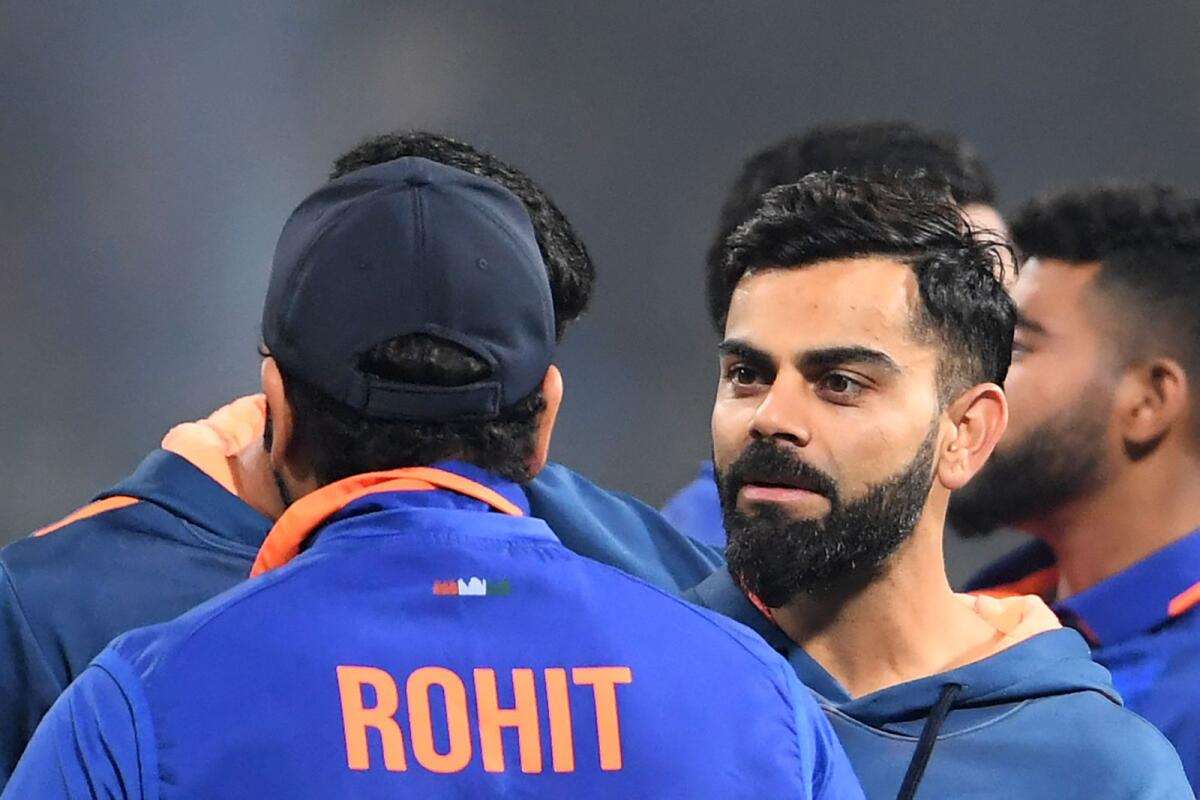 India's Virat Kohli (right) speaks with his team captain Rohit Sharma. — AFP