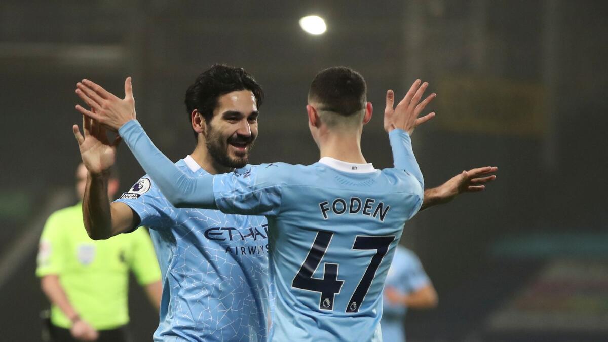 Manchester City's Ilkay Gundogan (left) celebrates with Phil Foden. (AP)