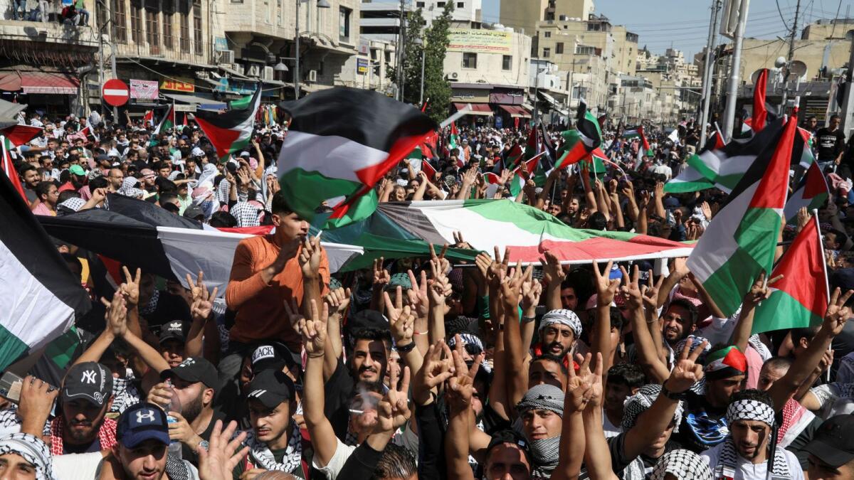Jordanians gather in a rally to express solidarity with Palestinians in Gaza, in Amman. — Reuters