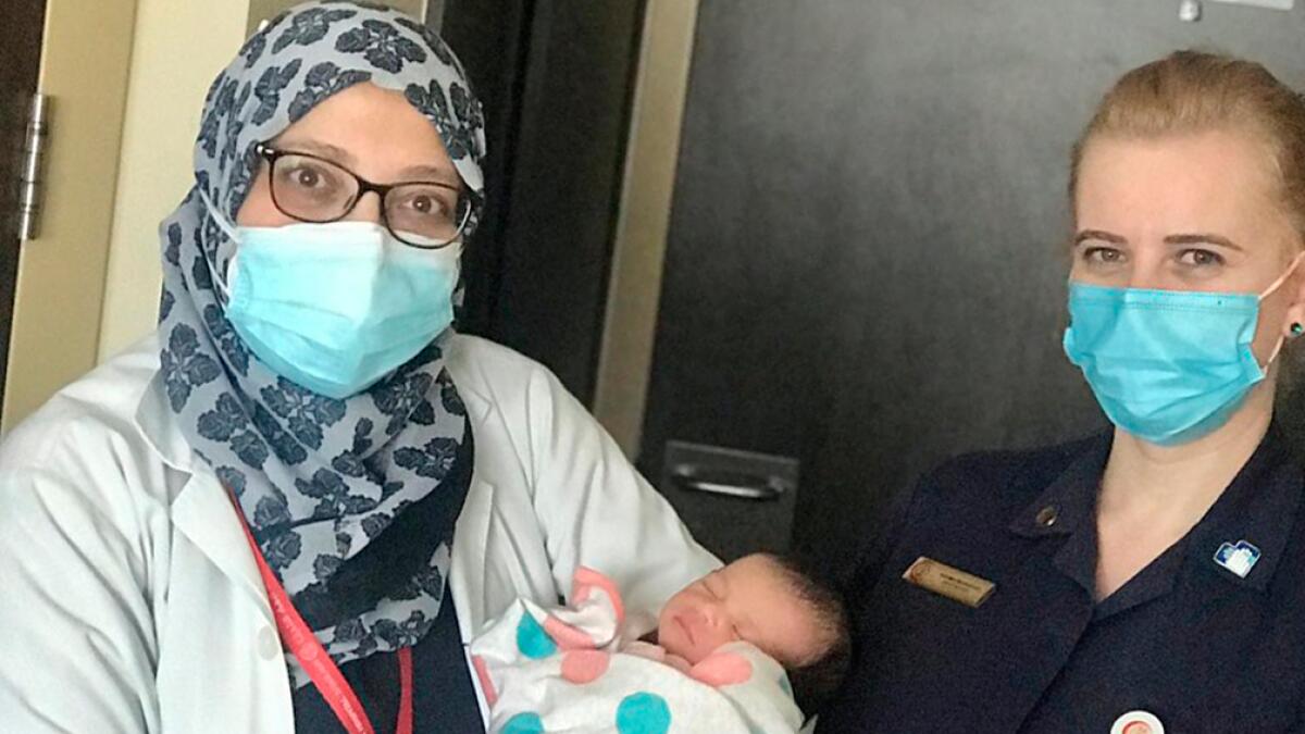 baby in car, woman delivers baby, Al Zahra hospital, childbirth, Sharjah, parking lot