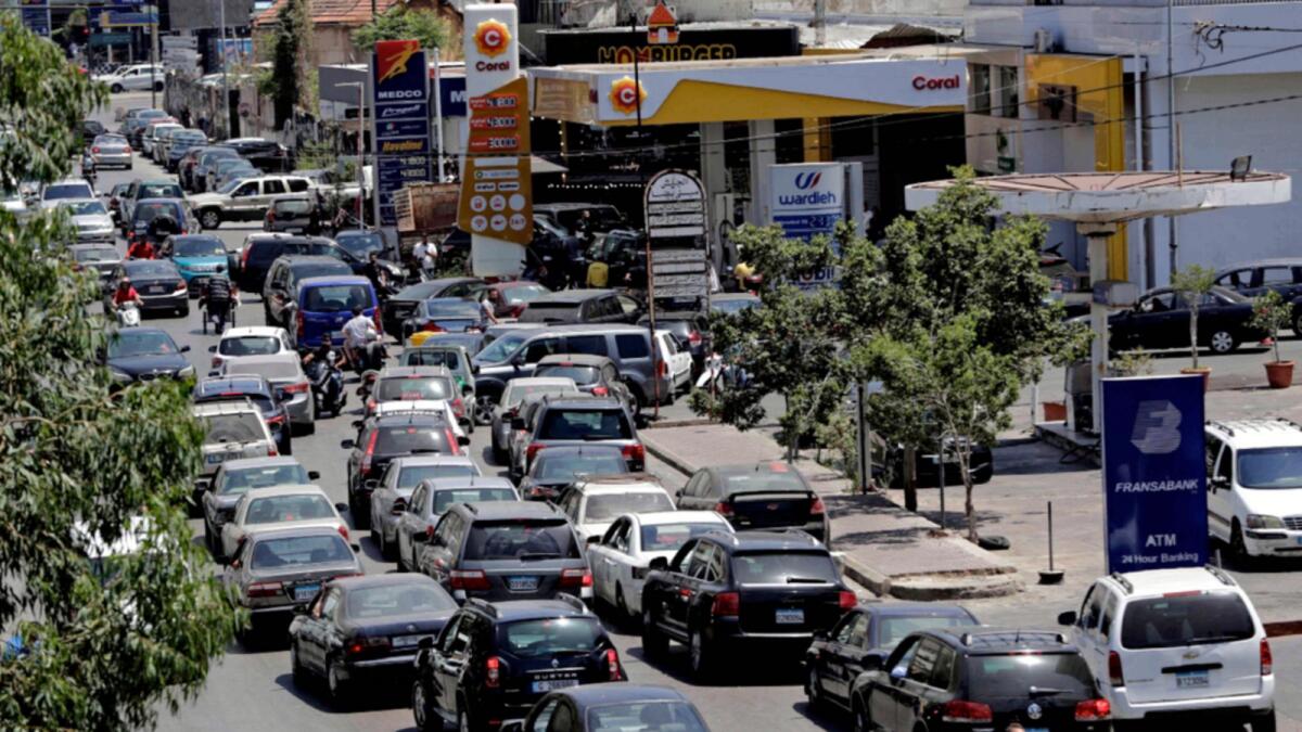 Vehicles queue-up for fuel at a petrol station in Lebanon's capital Beirut on June 11 amid severe fuel shortages.— AFP