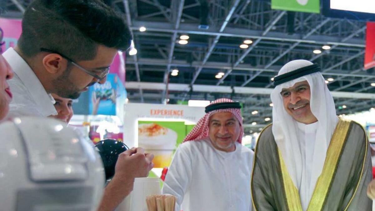 Sami Ahmad Dha’en Al Qamzi tours after the opening of Gitex Shoppers at the Dubai World Trade Center on Wednesday.  