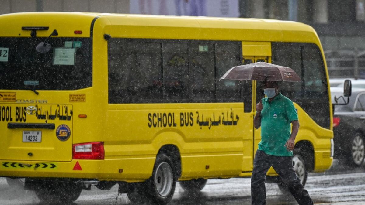 Rain, uae, weather, downpour, dubai, winter, cloudy, rainy, umbrella, school bus,