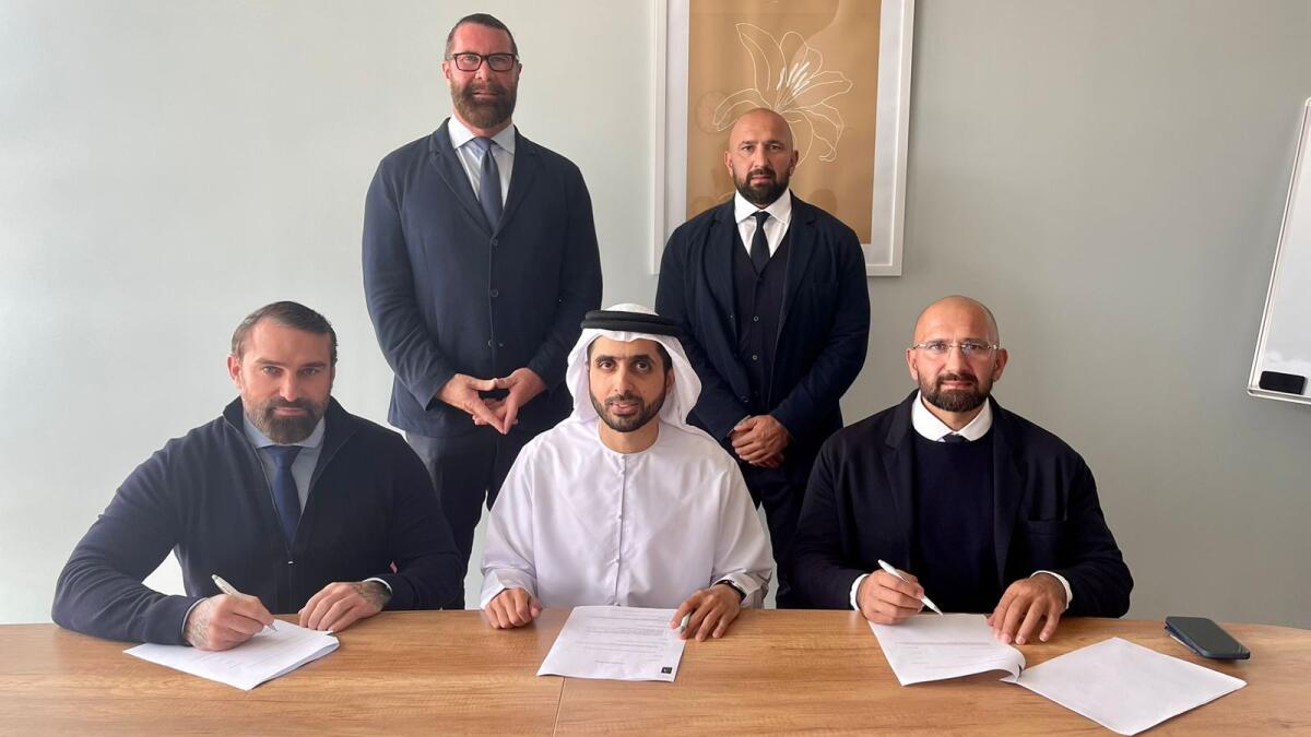 Sheikh Mohammed bin Maktoum bin Juma Al Maktoum signing the contract for his investment in globally patented compliance protocol, Astra Enterprise. Also seen in the picture are Jez Ali, Arthur Ali, Patrick Damien O'Brien, and Ant Middleton.