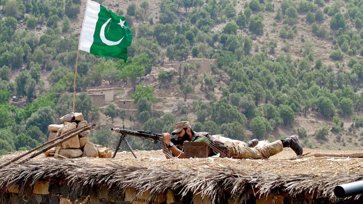 A Pakistani army soldier takes a position during a military operation against militants in Pakistan’s Khurramtribal region.