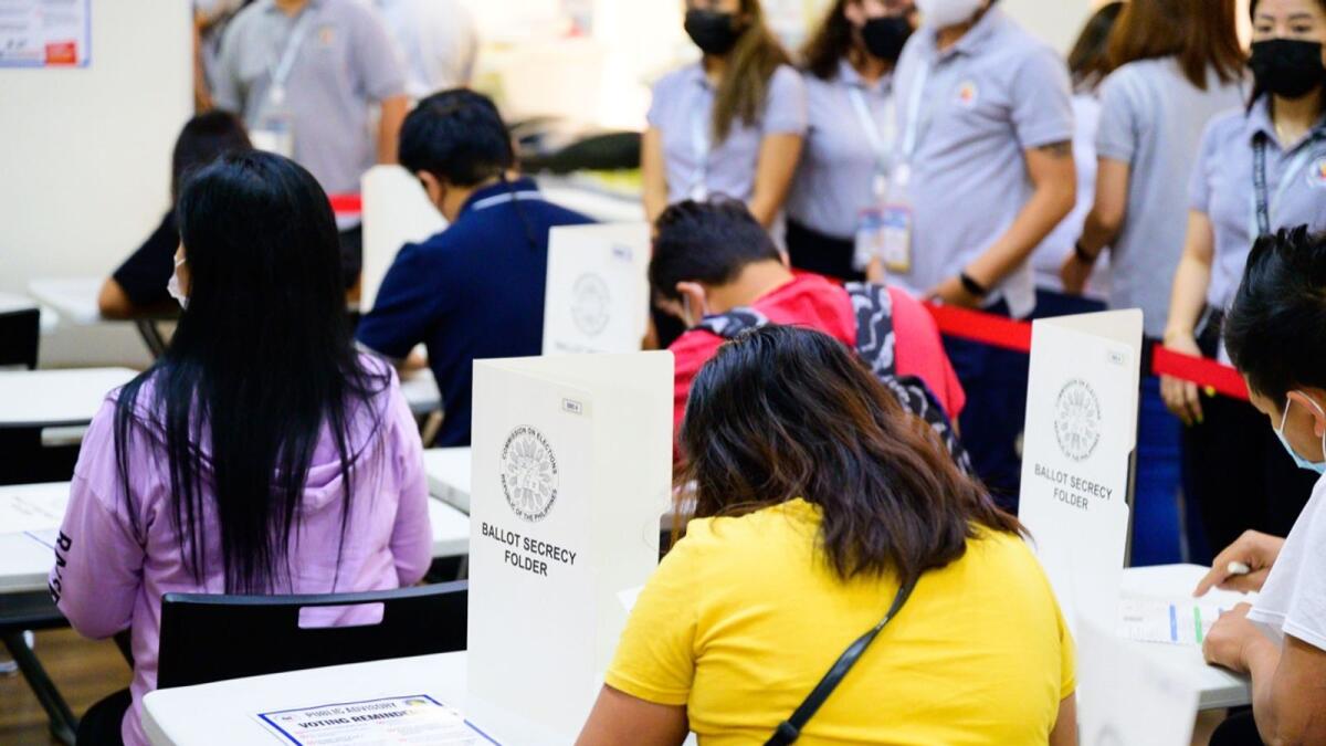 First set of voters cast their ballot at the Philippines Consulate. Photo by Neeraj Murali.