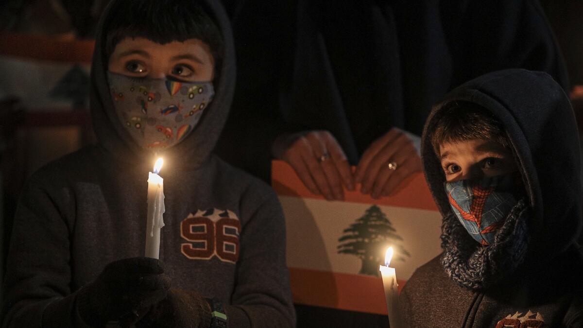Children take part in a vigil for the victims of the deadly explosion which devastated the port and large parts of the city of Beirut, in front of the Lebanon Embassy in Santiago, Chile. Photo: AP
