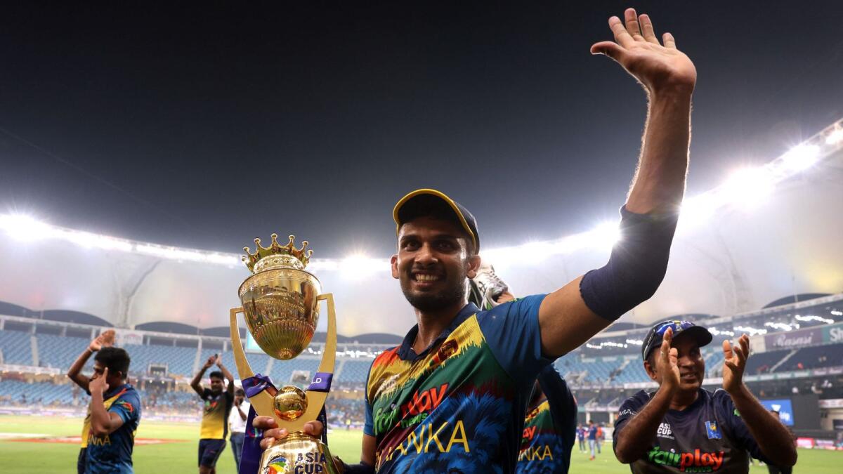 Sri Lankan captain Dasun Shanaka celebrates with the trophy after winning the Asia Cup. — Reuters