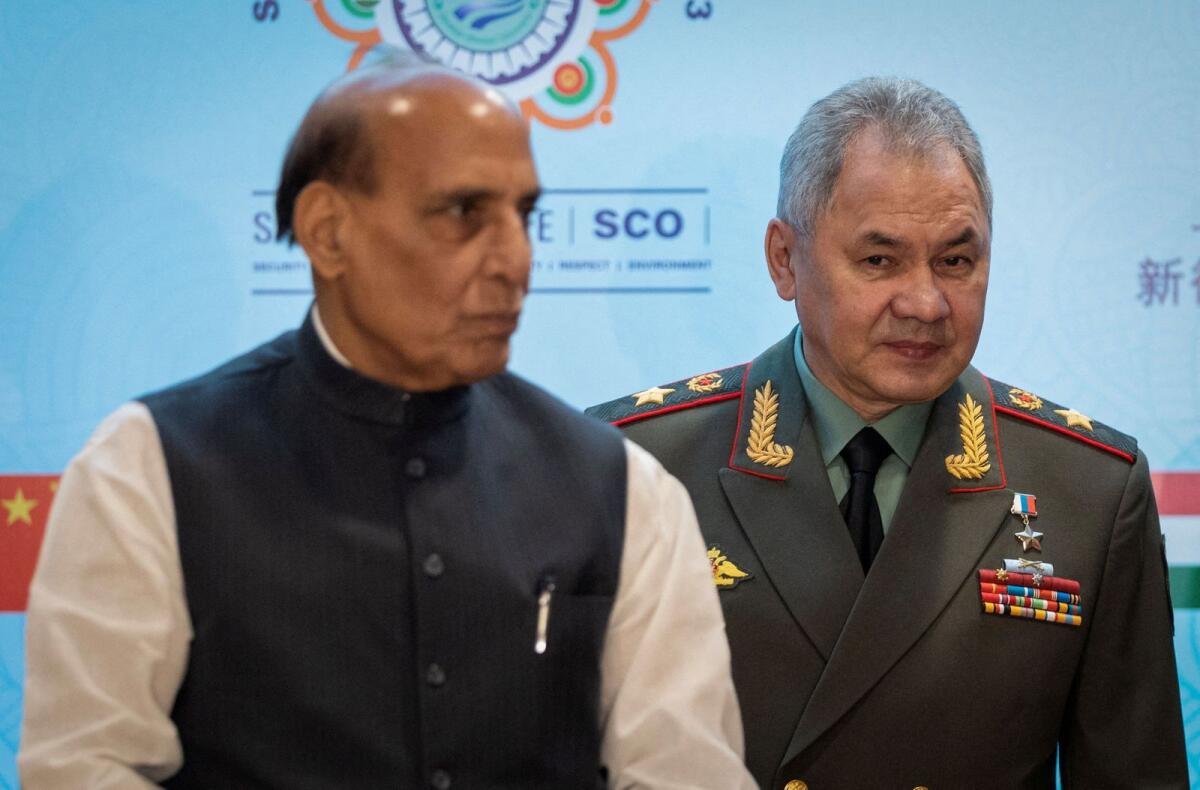 Indian Defence Minister Rajnath Singh and his Russian counterpart Sergei Shoigu  pose for a picture before the start of the Shanghai Cooperation Organisation (SCO) meet in New Delhi on Friday. — Reuters