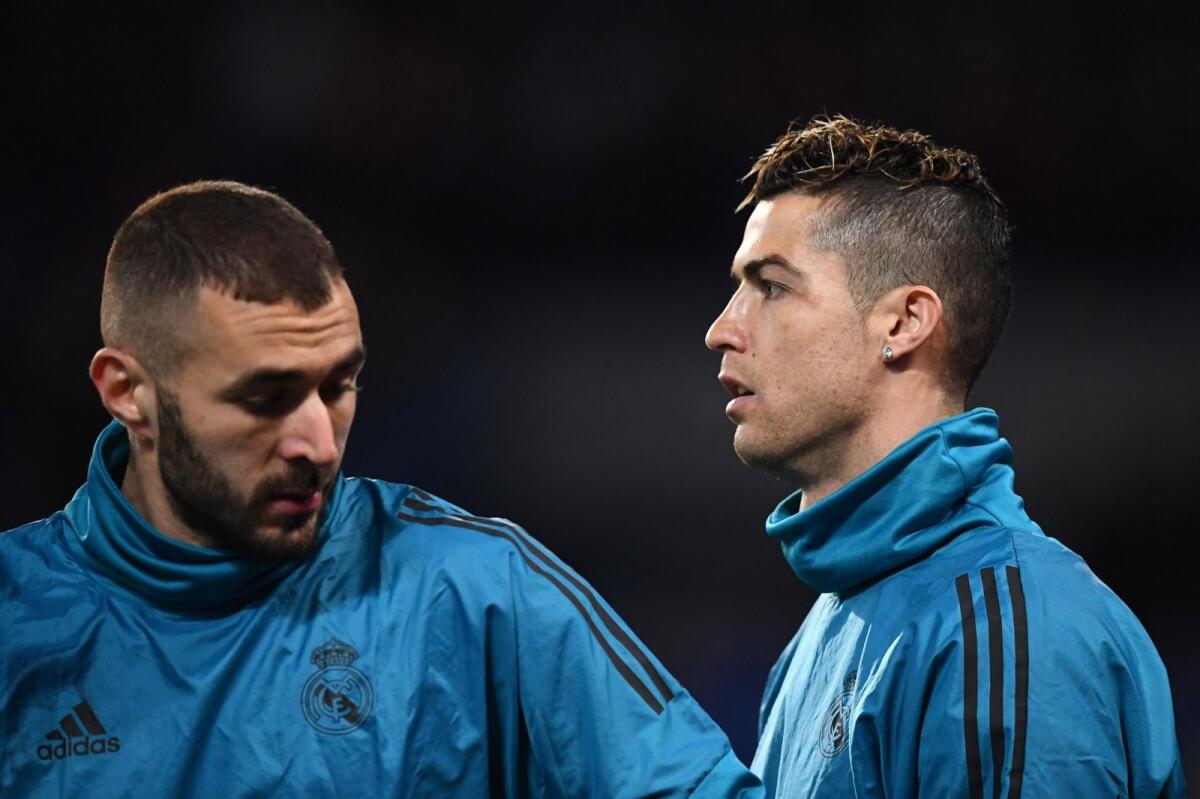 Karim Benzema (left) and Cristiano Ronaldo. — AFP File