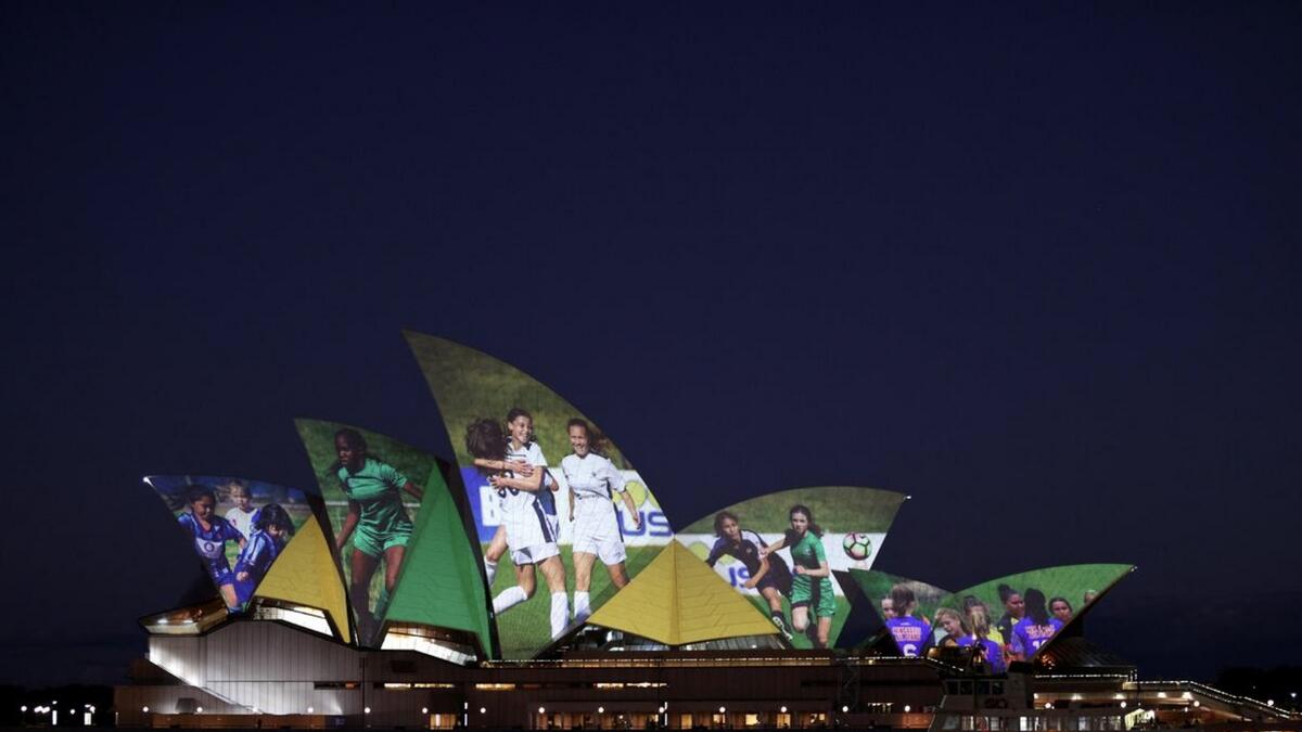 The Sydney Opera House lights up in celebration of Australia and New Zealand's joint bid to host the Fifa Women's World Cup 2023, in Sydney, Australia on Thursday. - Reuters