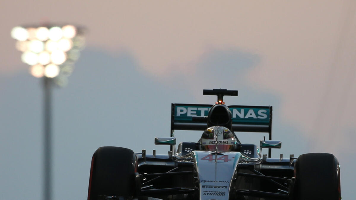 Mercedes AMG Petronas F1 Team's British driver Lewis Hamilton  leaves the pits during the qualifying session at the Yas Marina circuit in Abu Dhabi on November 28, 2015 ahead of the Abu Dhabi Formula One Grand Prix.  AFP PHOTO / KARIM SAHIB