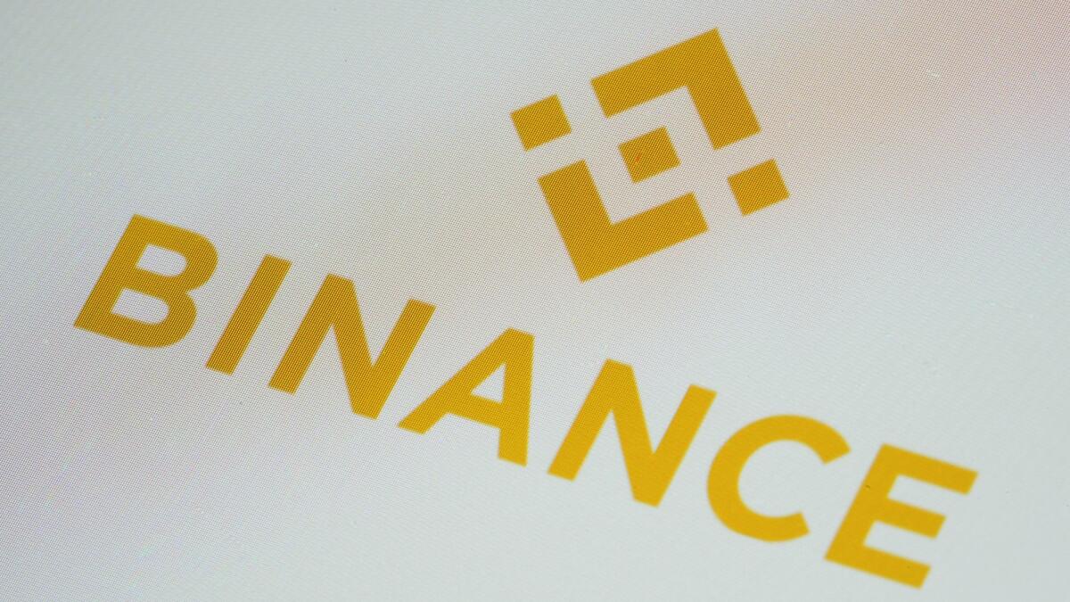 The Binance app icon is seen on a smartphone. — AP