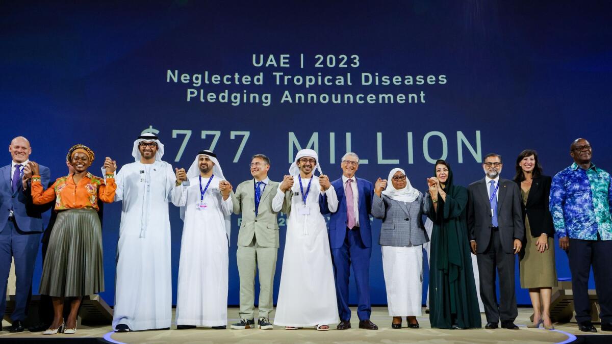 Dr Sultan Al Jaber, COP28 President (L3), Chris Hohn (L5), Sheikh Abdullah bin Zayed Al Nahyan, Minister of Foreign Affairs, UAE (L6), Bill Gates (R6), Samia Suluhu, President of Tanzania (R5) and Reem Al Hashimi, UAE Minister of State for International Cooperation (R4) and other attendees at the Reaching the Last Mile Forum 2023 at Al Waha Theatre during the UN Climate Change Conference COP28 at Expo City Dubai.